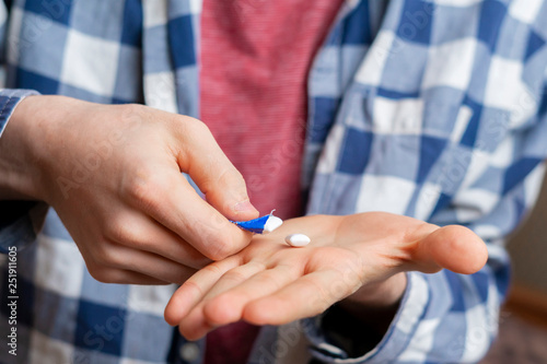 persons hand take chewing gum b