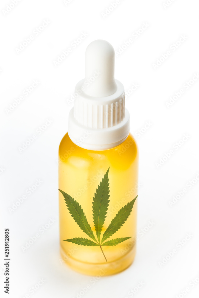 golden cannabis oil in a dropper bottle golden cannabis oil in a dropper bottle