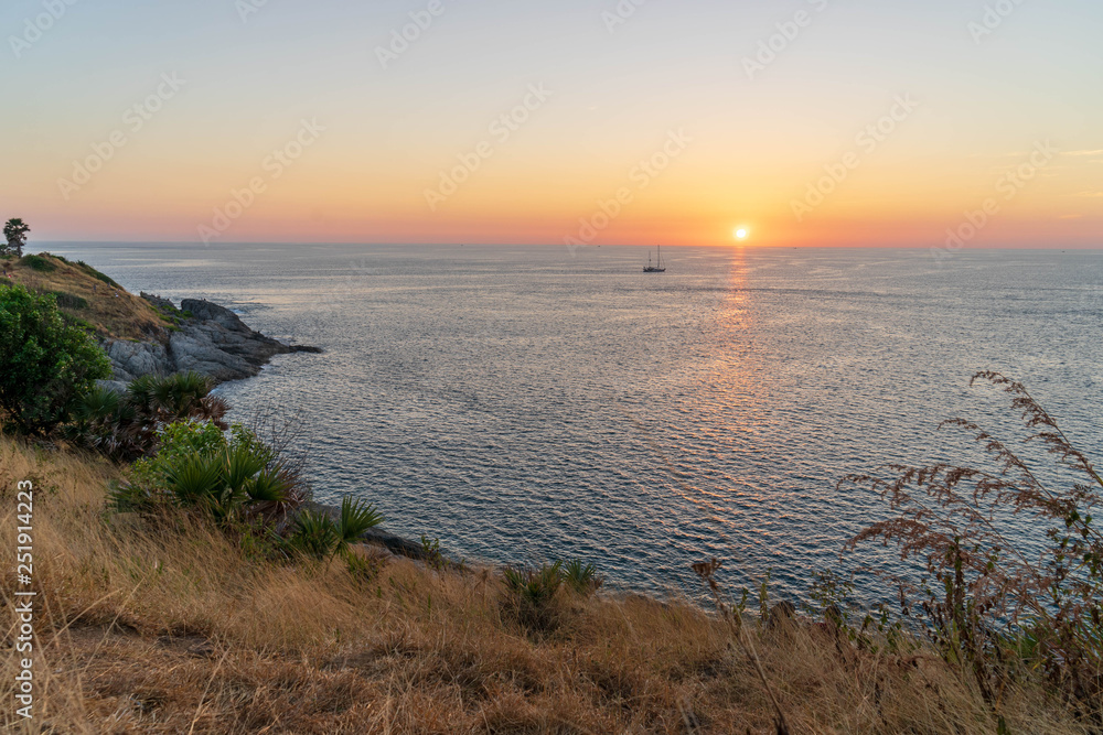 Sunrise view from Promthep cape, Phuket island, Southern Thailand with beautiful sea water, twilight sky.