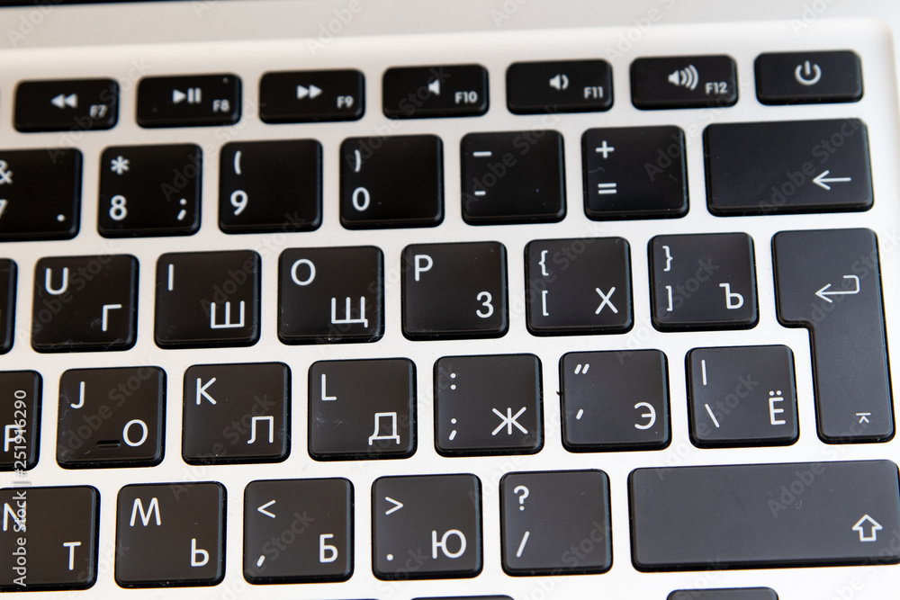 Close up of keyboard of a modern laptop. Enter button Close up of keyboard of a modern laptop. Enter button