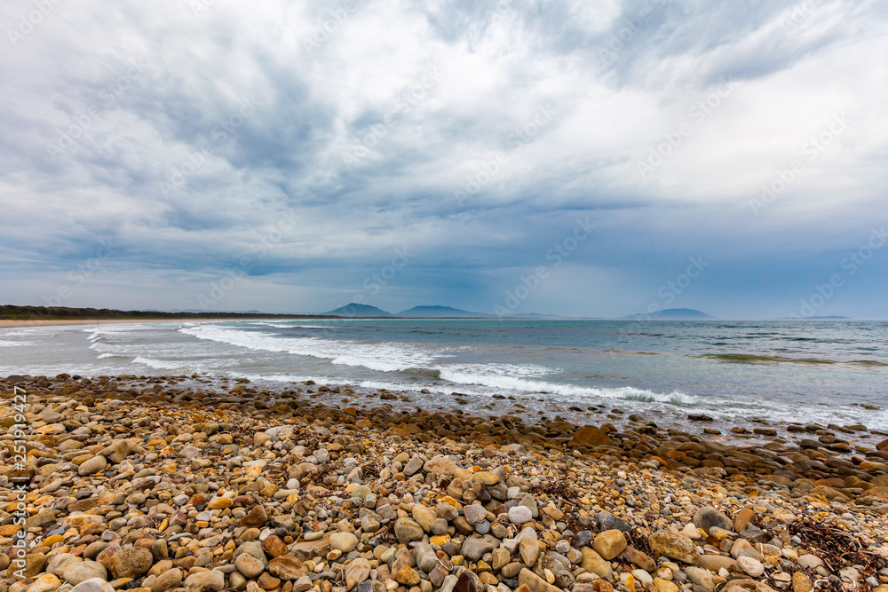 Ocean coastline and pebbles on the beach at Crowdy Head, New South Wales, Australia Ocean coastline and pebbles on the beach at Crowdy Head, New South Wales, Australia
