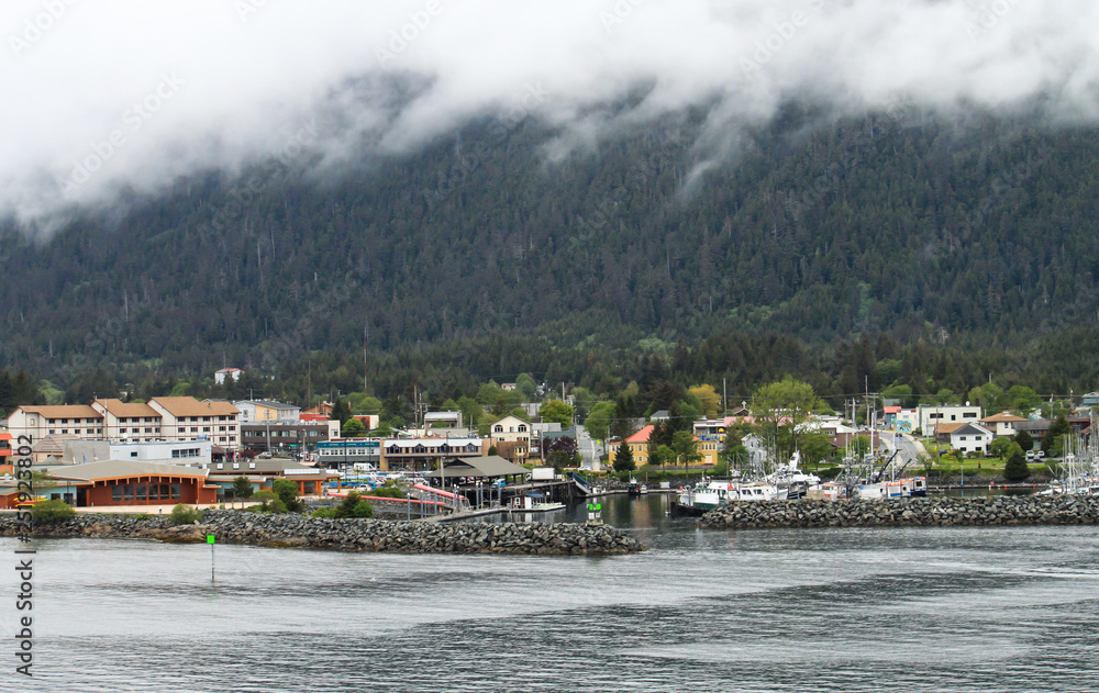 Sitka Alaska from the water on a grey cloudy day.