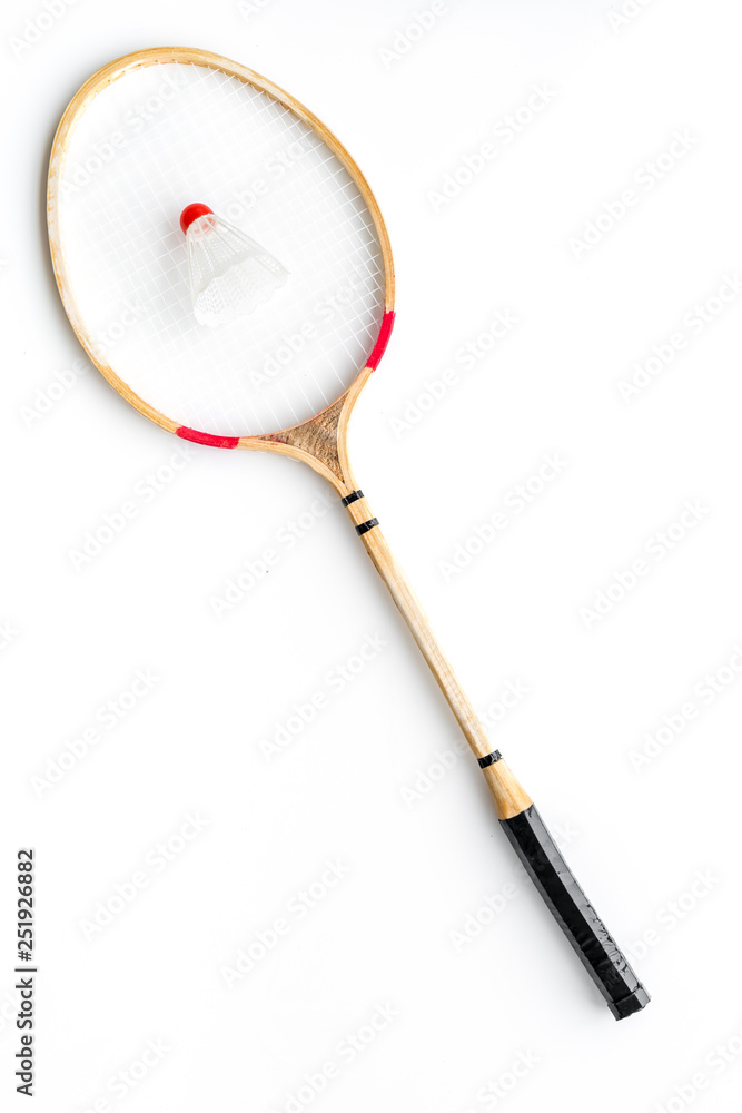 Badminton concept. Badminton racket and shuttlecock on white background top view space for text Badminton concept. Badminton racket and shuttlecock on white background top view space for text