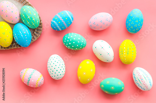 Easter composition. Decorated pastel Easter eggs on pink background
