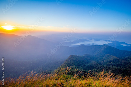 Rrainforest mountain viewpoint of Sanknokwua (San Knok Wua) hill at Khao Laem National Park. The highest peak in Kanchanaburi photo during sunrise.