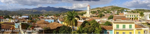 Wide Panoramic View of City Skyline, Bell Tower on Plaza Mayor and Colonial Houses in Trinidad, Cuba - a Unesco World Heritage Site © Autumn Sky