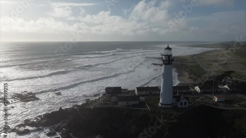 Aerial shot  of the lighthouse on the coast in the pacific ocean, very cinematic