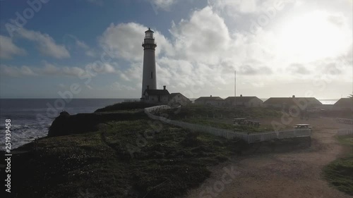 Aerial shot  of the lighthouse on the coast in the pacific ocean, very cinematic