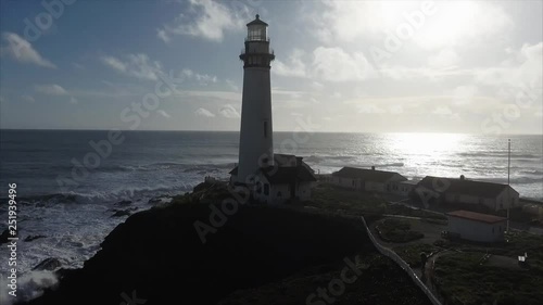 Aerial shot  of the lighthouse on the coast in the pacific ocean, very cinematic
