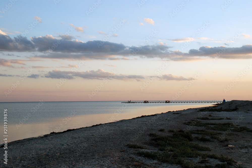 the pink dawn of sunset over the sea shore the pink dawn of sunset over the sea shore