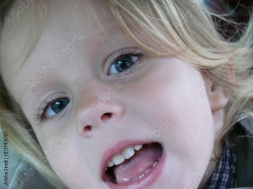 baby's face close with mouth open