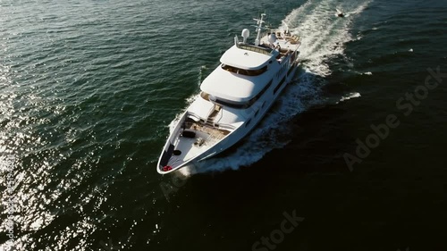 flying above the yacht in the ocean, aerial shot in malibu, california 