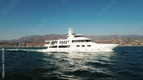 yacht in the ocean, aerial shot in malibu, california 