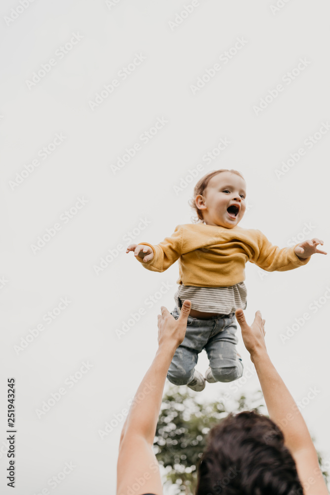 happy little boy playing with family happy little boy playing with family