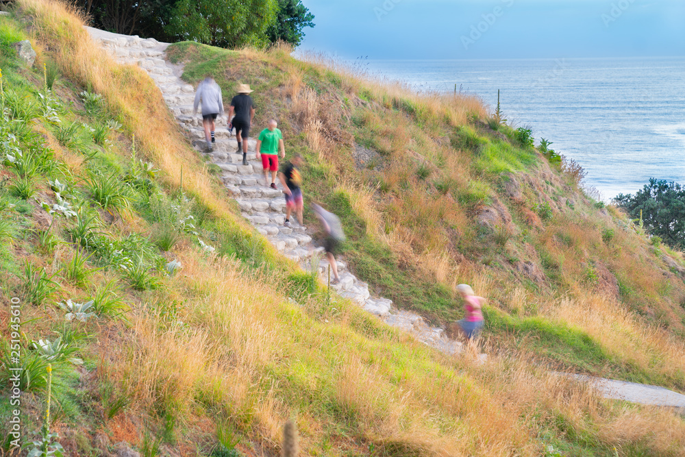 People on stone steps down track up Mount Maunganui People on stone steps down track up Mount Maunganui