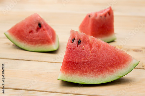 Watermelon slice on wooden table 