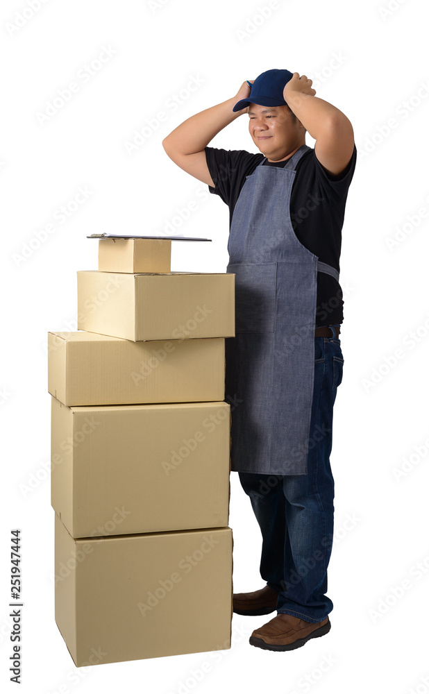 delivery man in Black shirt and apron with stack of boxes isolated delivery man in Black shirt and apron with stack of boxes isolated