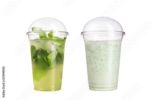 Delicious fruit smoothies in plastic cups, on a white background. Two cocktails with a taste of mojito and milk.