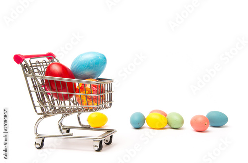 Easter shopping. Handmade colored eggs in cart. Business and selling in spring