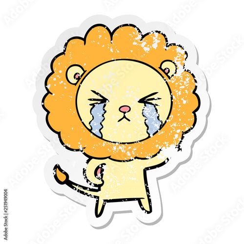 Fototapeta Naklejka Na Ścianę i Meble -  distressed sticker of a cartoon crying lion