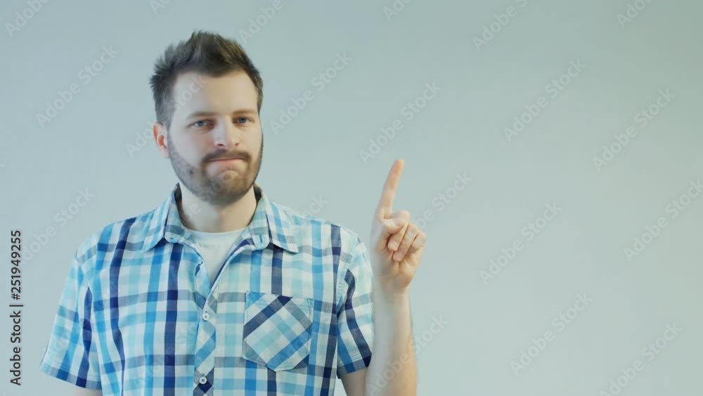man shakes head and index finger to avoid offer, disagree or no sign, not allowed, rejection gesture, doesn't give consent, copy space man shakes head and index finger to avoid offer, disagree or no sign, not allowed, rejection gesture, doesn't give consent, copy space