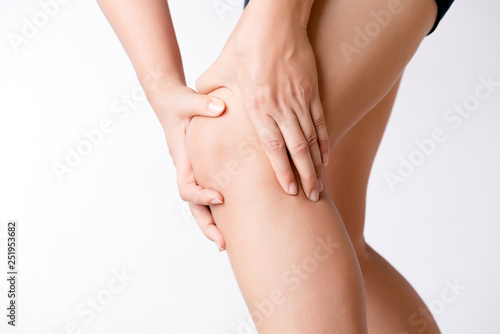 Runner sport knee injury. Closeup young woman in knee pain while running. Healthcare and medical concept. © Siam