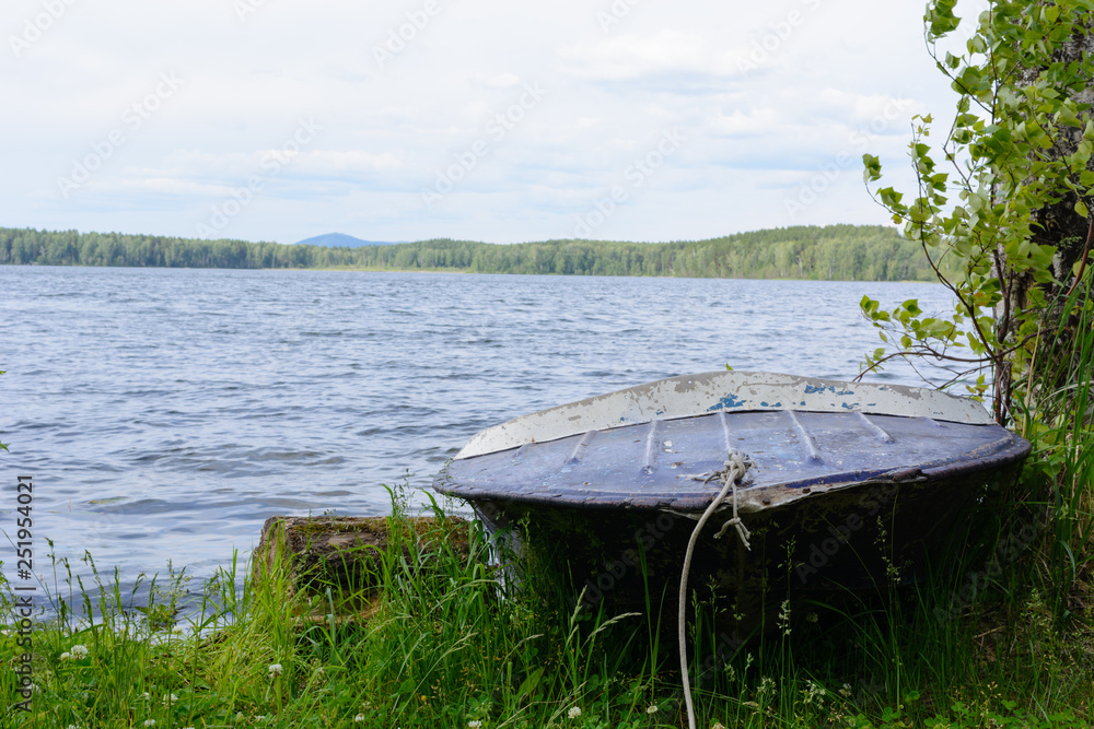 the boat on the bank of the lake the boat on the bank of the lake