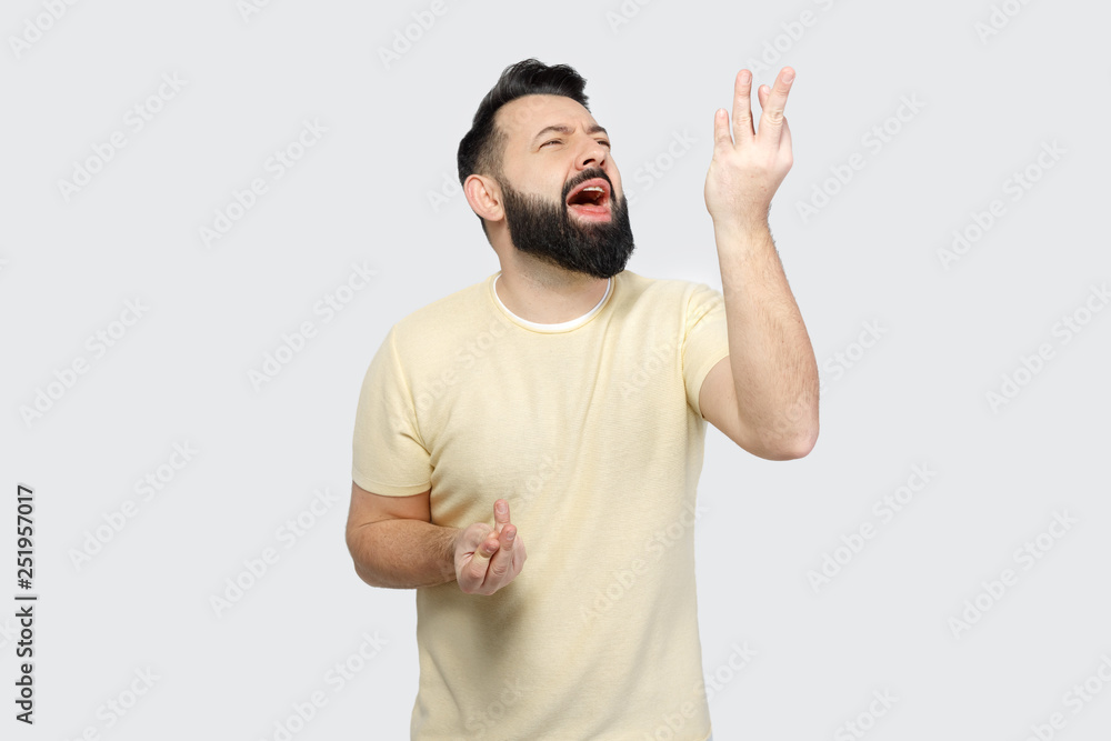 The pretty bearded man shows emotionally The pretty bearded man shows emotionally