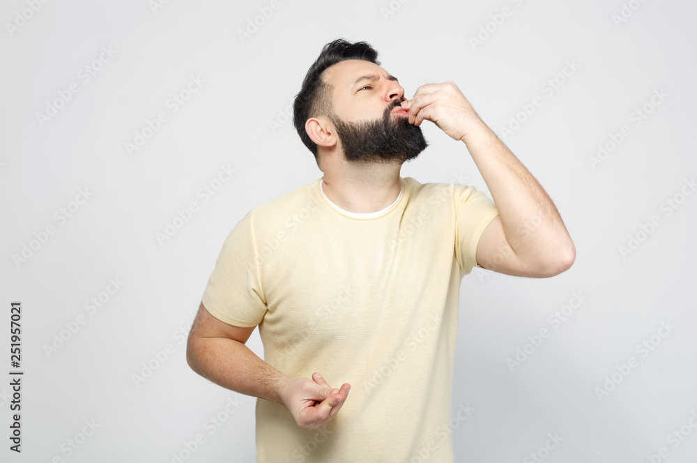 The pretty bearded man shows emotionally The pretty bearded man shows emotionally