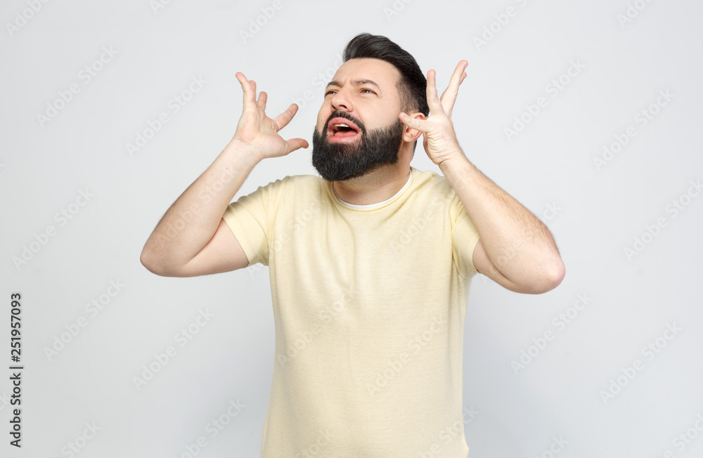 The pretty bearded man shows emotionally The pretty bearded man shows emotionally