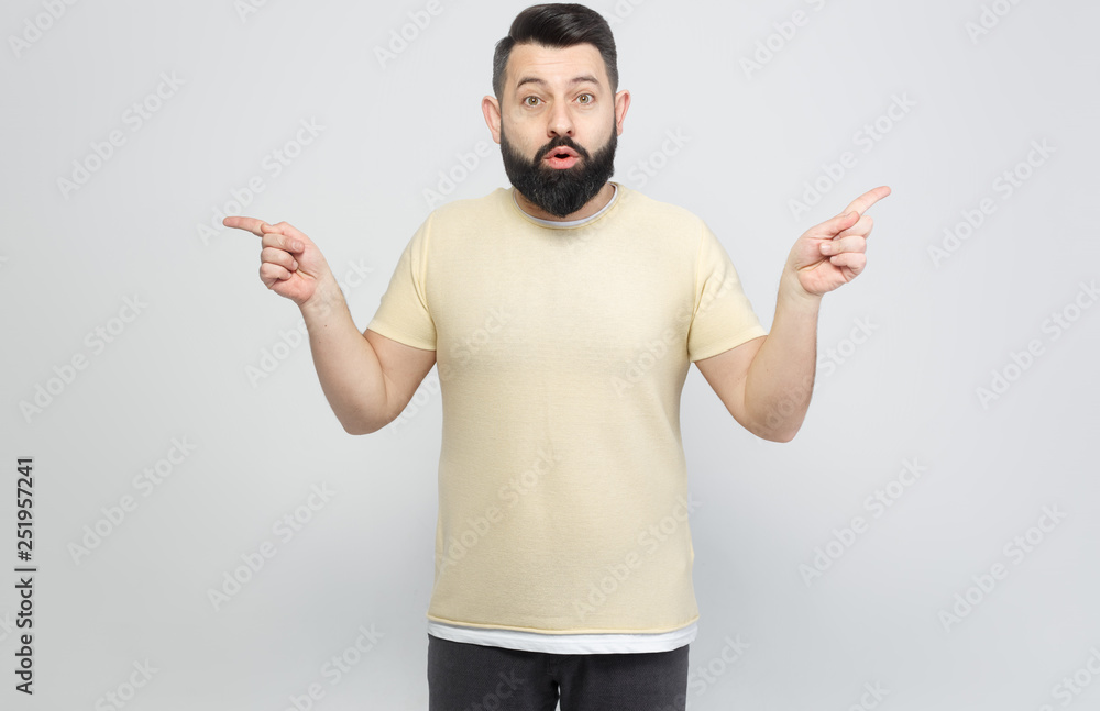 Fototapeta premium The pretty bearded man shows emotionally