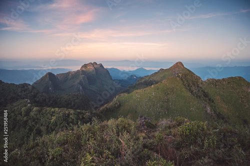 Landscape of mountain range in wildlife sanctuary at sunset