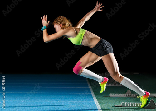 Female athlete starting her sprint race running
