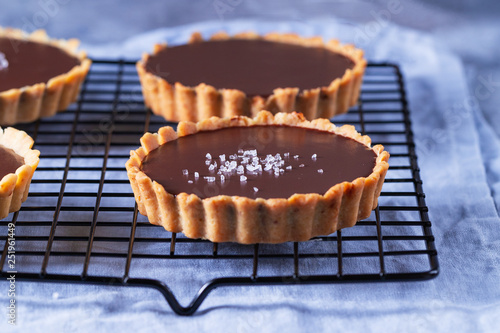 Chocolate tarts on a cooling rack