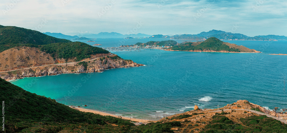 Breathtaking view from the road on the green mountains and beatiful turquoise ocean in Vietnam