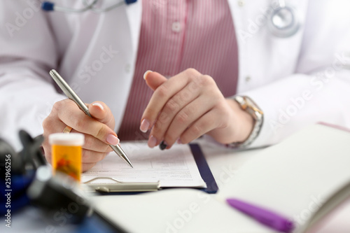 Female medicine doctor hand hold jar of pills