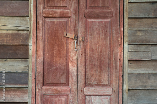 Old wooden window on yellow wall for vintage background