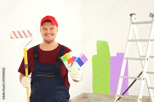Male painter in uniform wit...