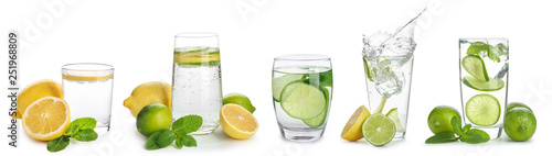 Glasses of infused water with citrus fruits on white background