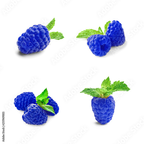 Set with fresh ripe blue raspberry on white background