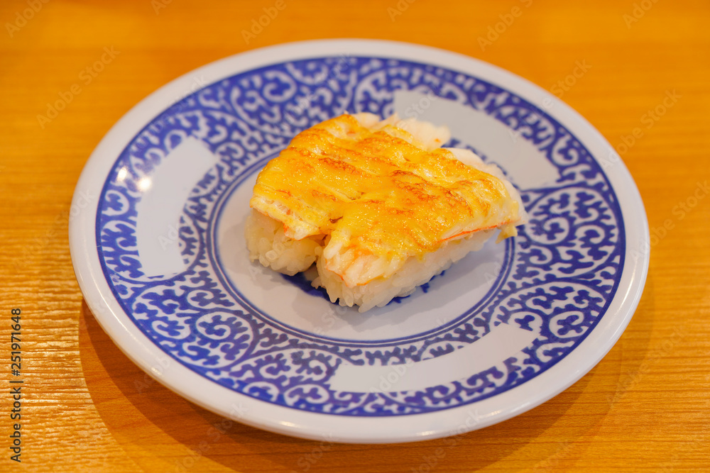 Close-up on Japanese shrimp sushi grilled with cheese. Close-up on Japanese shrimp sushi grilled with cheese.