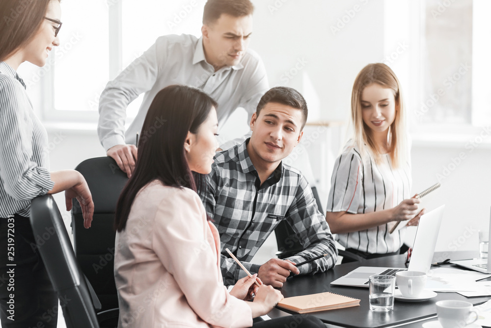 Young people having business meeting in office Young people having business meeting in office
