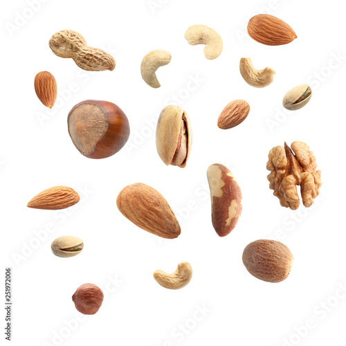 Falling nuts on white background photo
