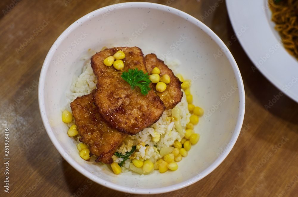 Fried pork chop with rice and corn . Asian delicacies foods . Fried pork chop with rice and corn . Asian delicacies foods .