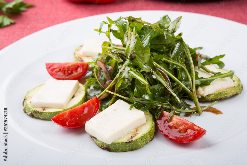 Grilled cheese salad mixed with arugula