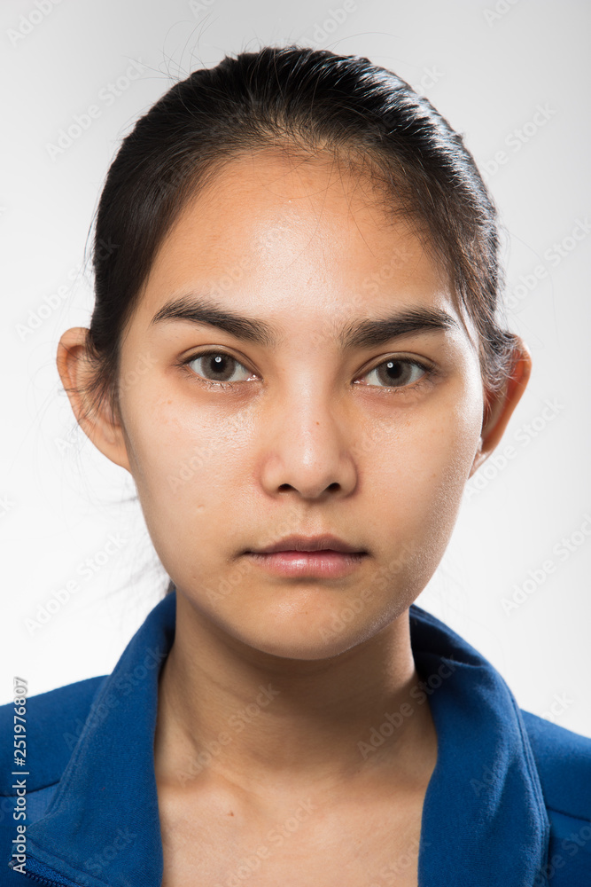 Asian Woman before applying make up hair style. no retouch, fresh face with acne, lips, eyes, cheek, nice smooth skin. Studio lighting white background, for aesthetics therapy treatment Asian Woman before applying make up hair style. no retouch, fresh face with acne, lips, eyes, cheek, nice smooth skin. Studio lighting white background, for aesthetics therapy treatment