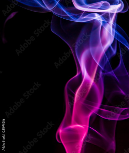 Colored smoke on black background