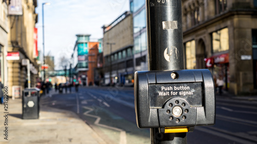Fototapeta Naklejka Na Ścianę i Meble -  Button to stop the traffic light in Manchester, United Kingdom