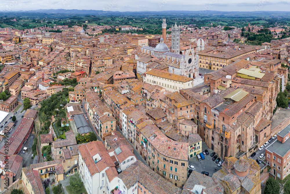 Aerial panoramic view of Siena Cathedral, Duomo di Siena, and Old Town of medieval city of Siena, Tuscany, Italy