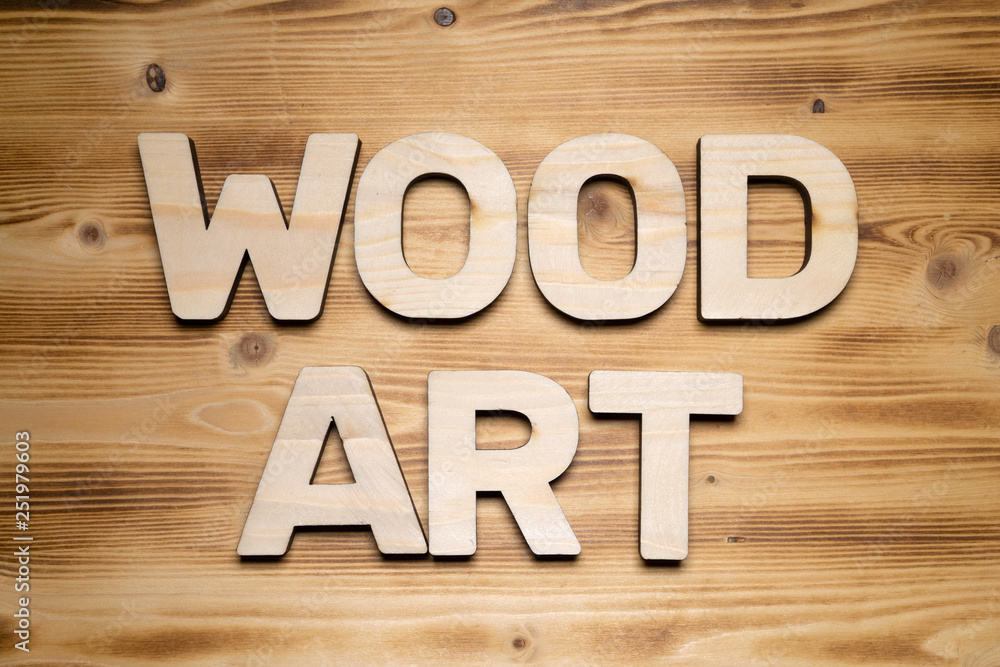 WOOD ART words made of wooden block letters on wooden board, top view. WOOD ART words made of wooden block letters on wooden board, top view.